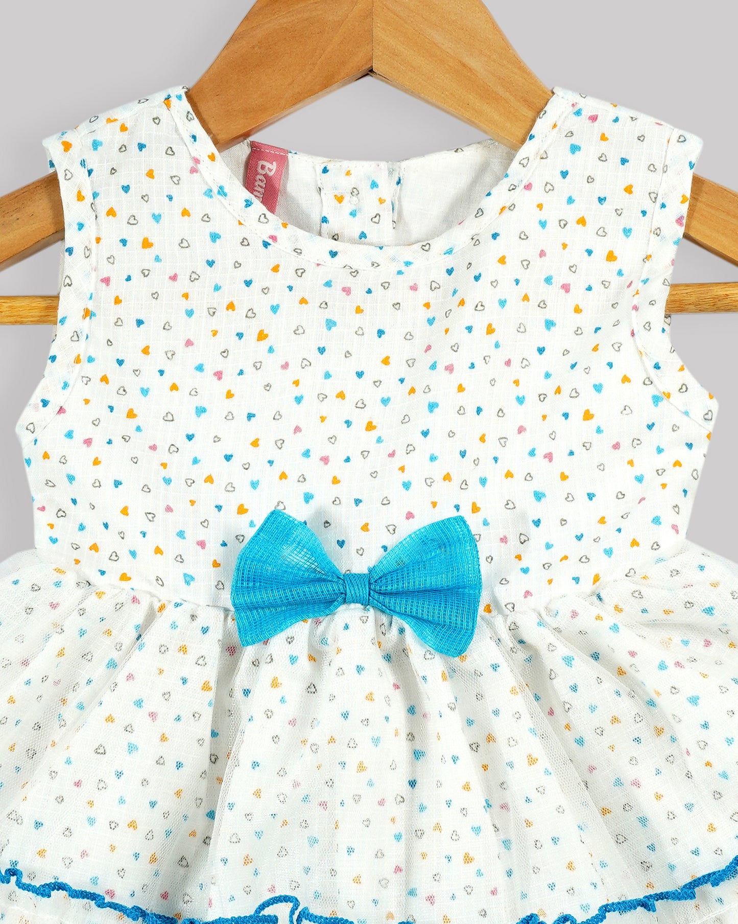 Best kidswear brand  in india. Kids tiered frock Heart print bow detail tiered dress with contrast baby lock stitch 