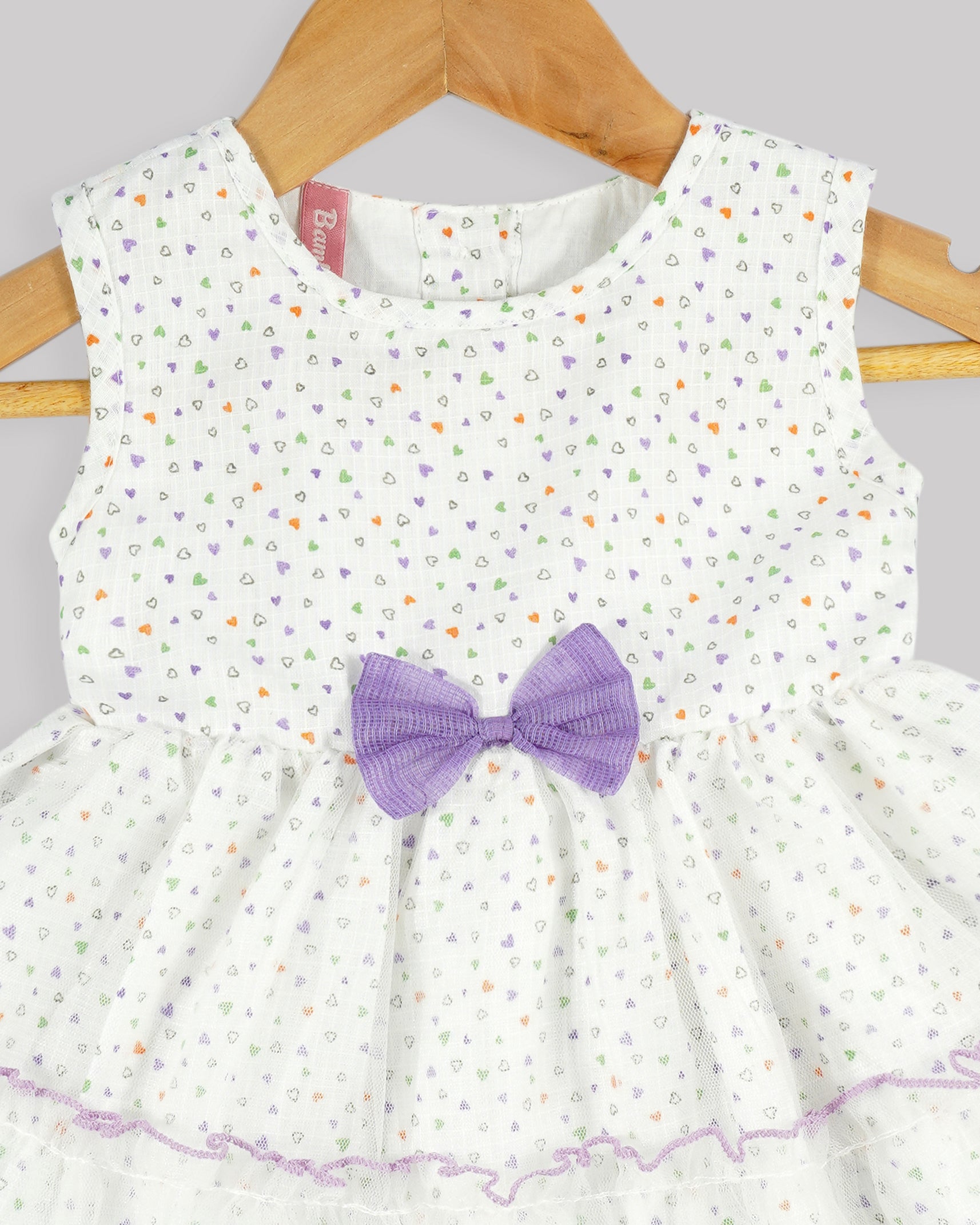 Best kidswear brand  in india. Kids tiered frock Heart print bow detail tiered dress with contrast baby lock stitch 